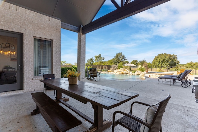 view of patio / terrace with a fenced in pool