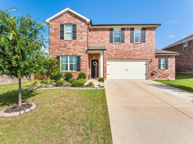 view of front of property featuring a front yard and a garage