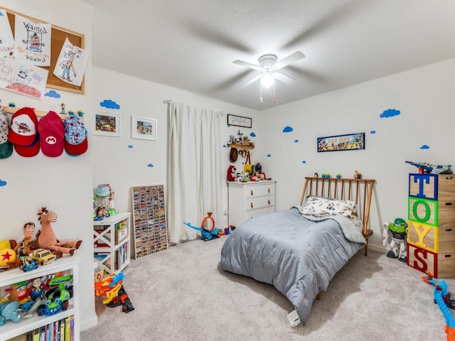 carpeted bedroom with ceiling fan