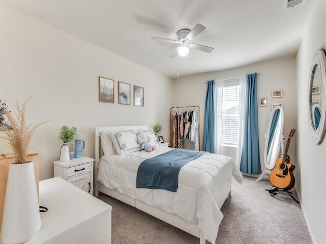 carpeted bedroom featuring ceiling fan