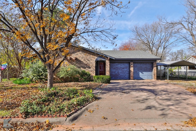 view of front of property featuring a garage and a carport