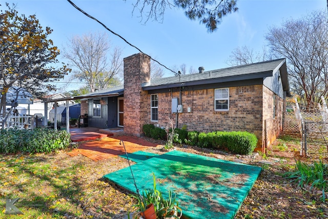 back of house featuring a patio