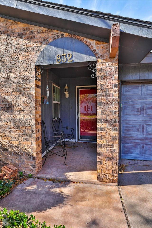 property entrance with a garage