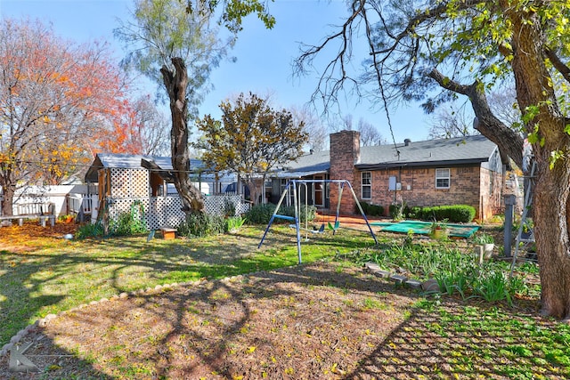 view of yard featuring a playground