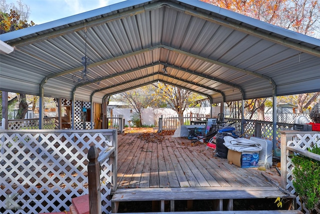 wooden deck with a carport