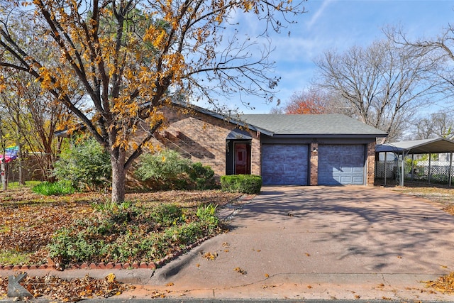 view of front of house with a garage and a carport