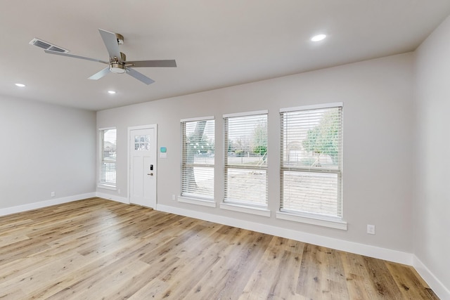 unfurnished room featuring ceiling fan and light hardwood / wood-style floors