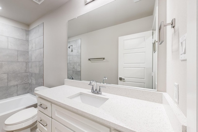 full bathroom featuring vanity, toilet, and tiled shower / bath