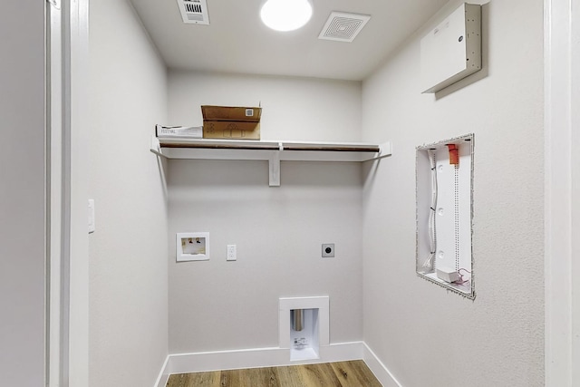 laundry room with washer hookup, electric dryer hookup, and hardwood / wood-style flooring