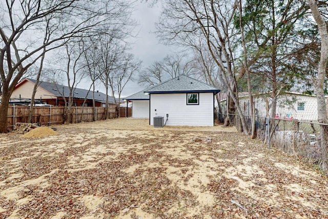 back of house featuring central AC unit