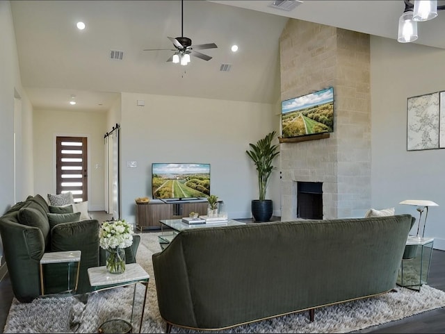 living room with recessed lighting, visible vents, a fireplace, and ceiling fan