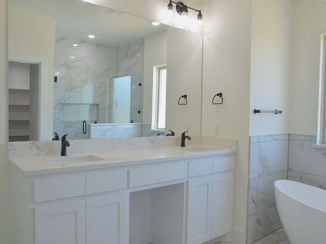 bathroom with vanity, tile walls, and plus walk in shower