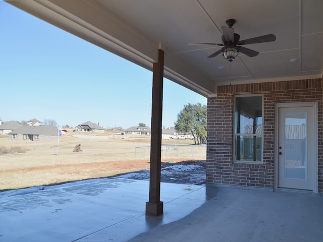 view of patio featuring ceiling fan