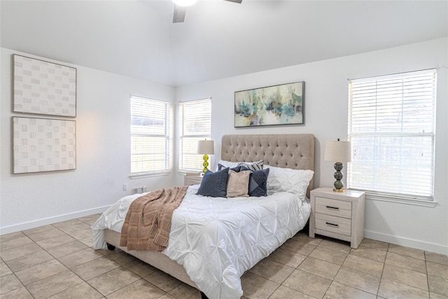 tiled bedroom featuring ceiling fan