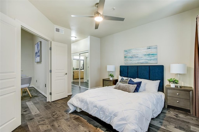 bedroom with ceiling fan and dark hardwood / wood-style flooring