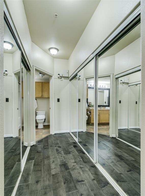 bathroom with vanity, hardwood / wood-style floors, and toilet