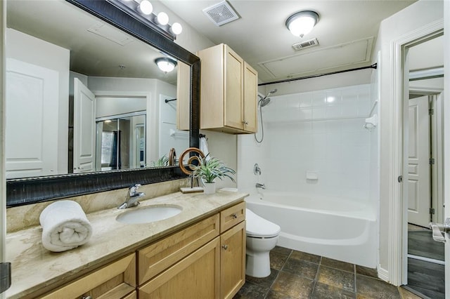 full bathroom featuring vanity, shower / washtub combination, and toilet