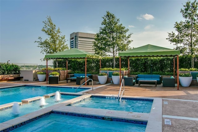 view of pool featuring a hot tub, a gazebo, and an outdoor living space