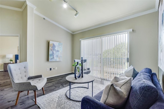 living room with lofted ceiling, crown molding, dark wood-type flooring, and rail lighting