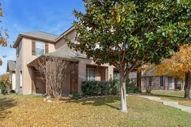 view of front of home with a front lawn