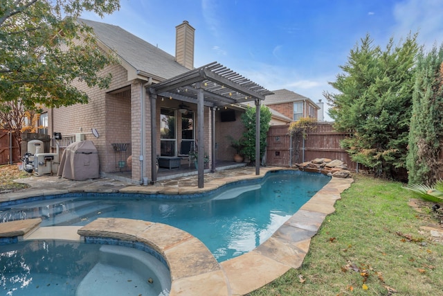 view of pool with a pergola and a patio area