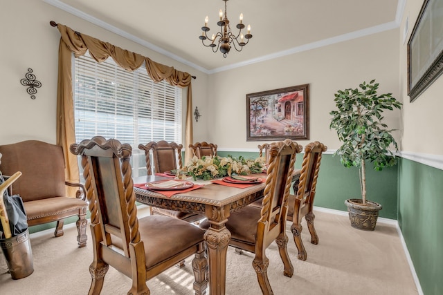 carpeted dining area with an inviting chandelier and ornamental molding