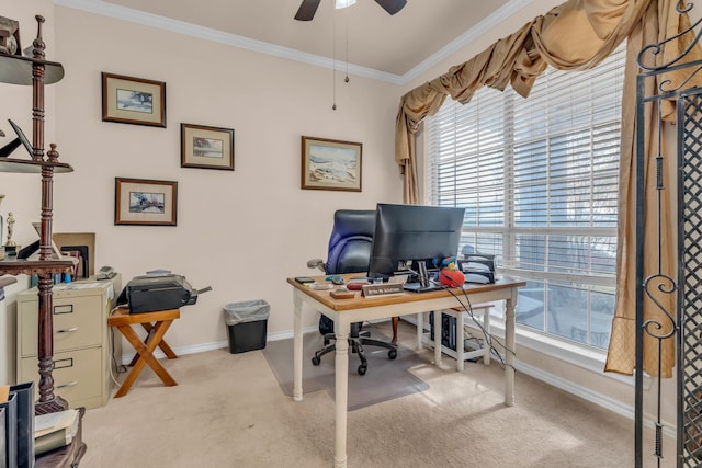 home office with crown molding, ceiling fan, and light carpet