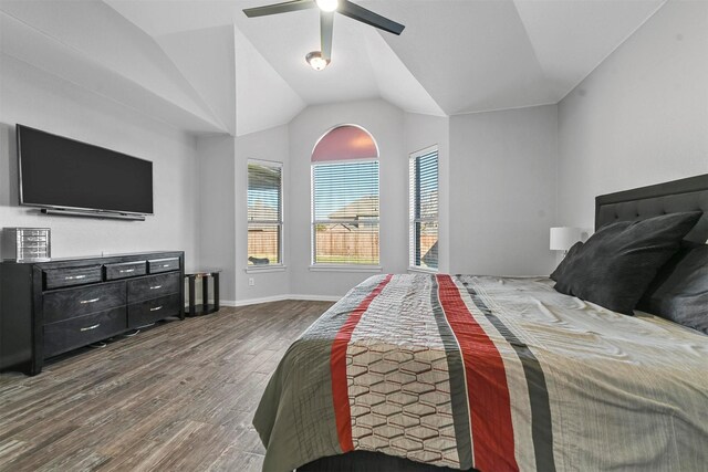 bedroom featuring hardwood / wood-style flooring, ceiling fan, and lofted ceiling