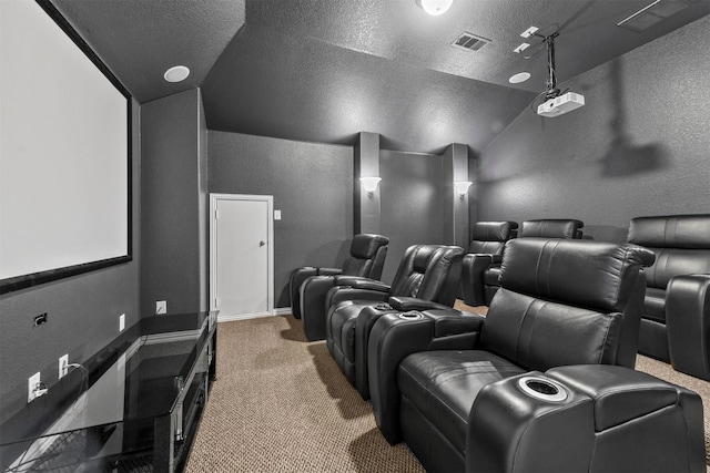 carpeted home theater with lofted ceiling