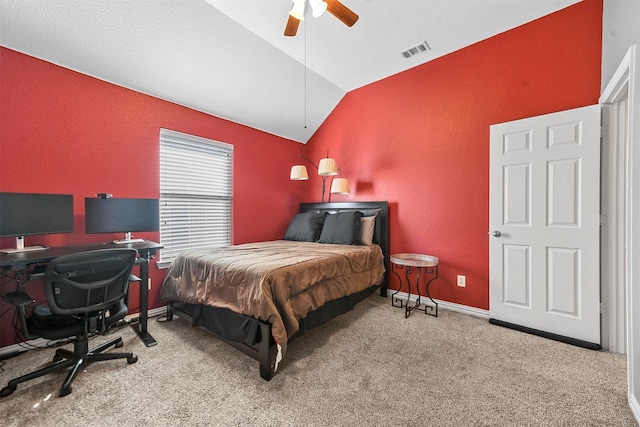 carpeted bedroom featuring ceiling fan and vaulted ceiling