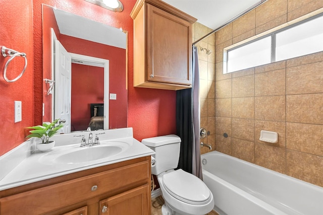 full bathroom with shower / bath combo, vanity, and toilet