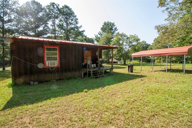 view of yard featuring a carport and cooling unit