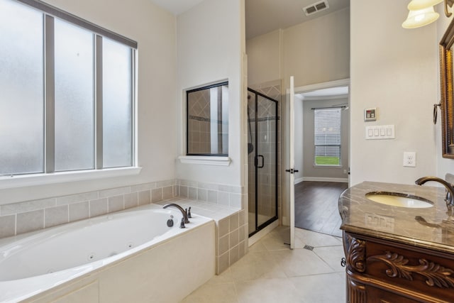 bathroom featuring vanity, tile patterned floors, and plenty of natural light