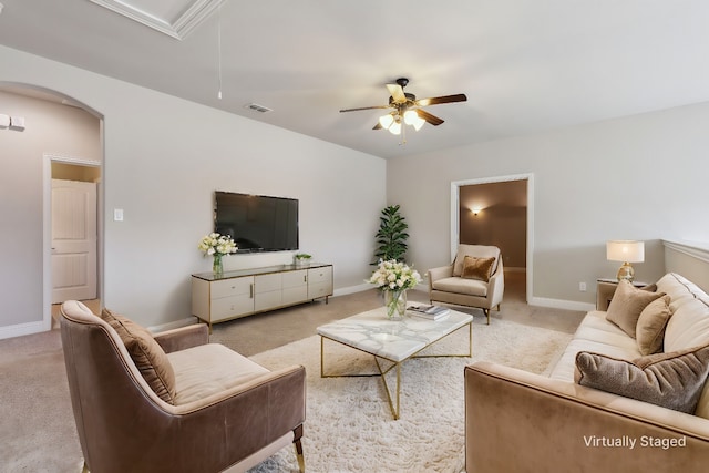 living room with light colored carpet and ceiling fan