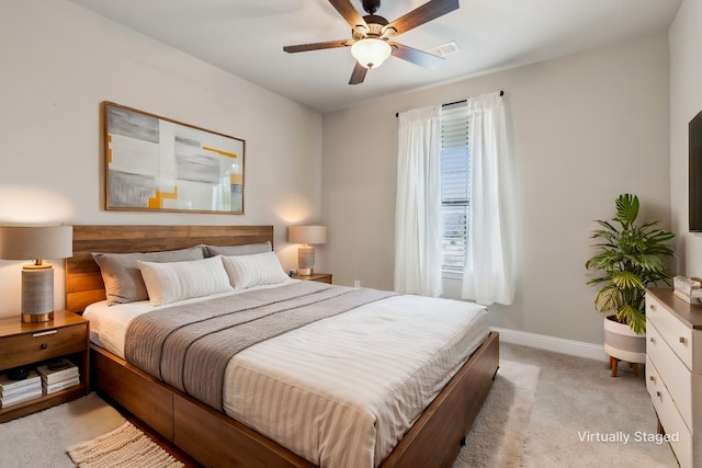 bedroom with light colored carpet and ceiling fan