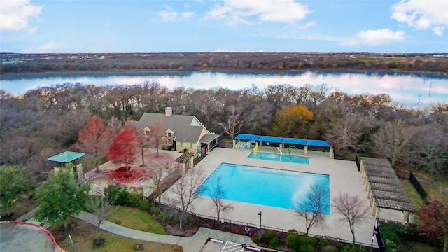 view of pool featuring a water view