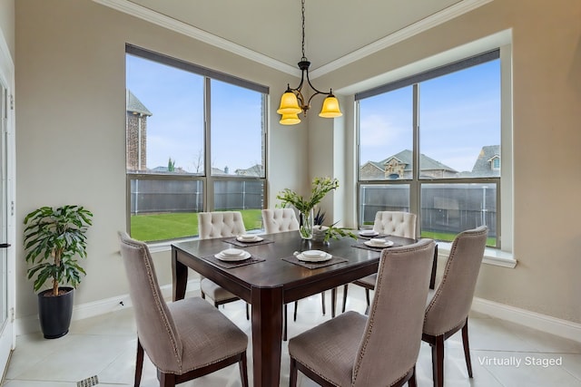 dining room featuring plenty of natural light, light tile patterned flooring, and a chandelier