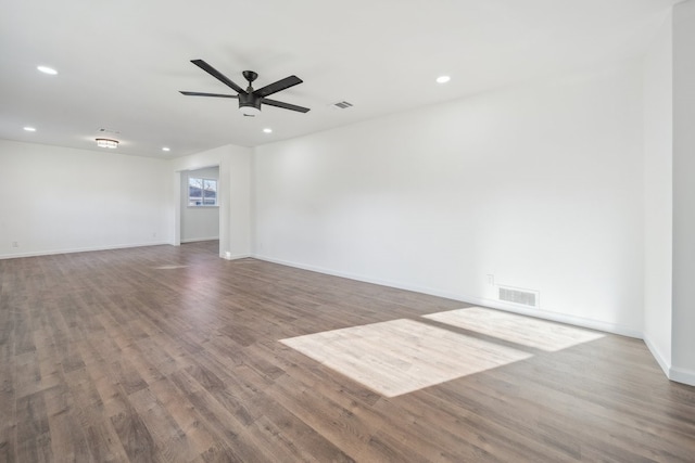 empty room with hardwood / wood-style flooring and ceiling fan