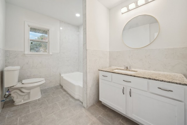 full bathroom featuring vanity, toilet, tile walls, and tub / shower combination