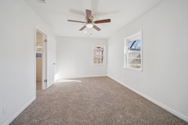 spare room with carpet floors and ceiling fan