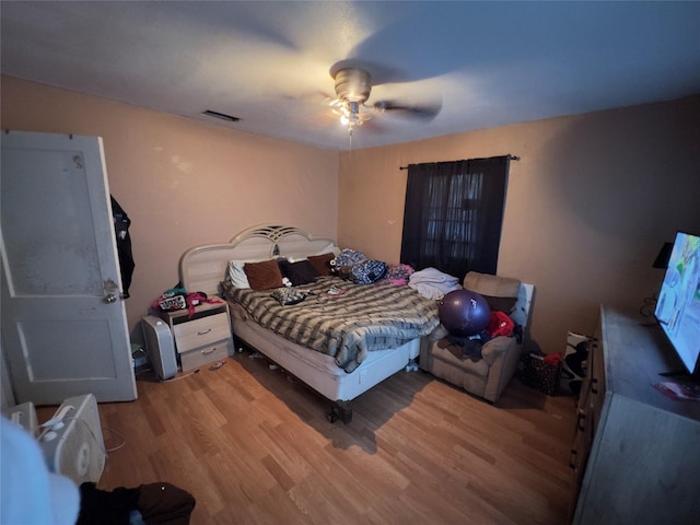 bedroom featuring ceiling fan and light hardwood / wood-style flooring