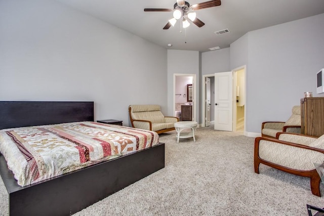 bedroom with connected bathroom, carpet floors, and ceiling fan