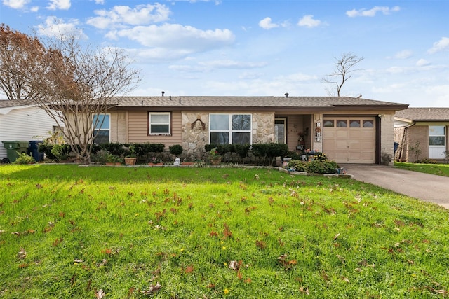 ranch-style home featuring a front yard and a garage