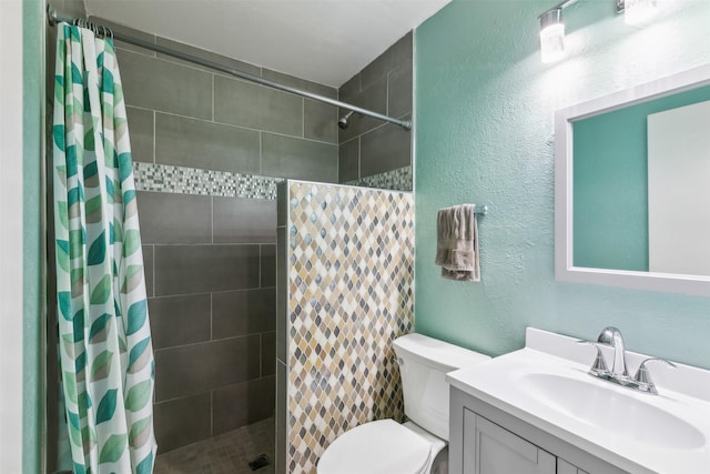 bathroom featuring a shower with curtain, vanity, and toilet