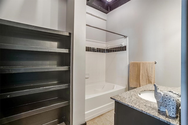 bathroom featuring vanity and a bath