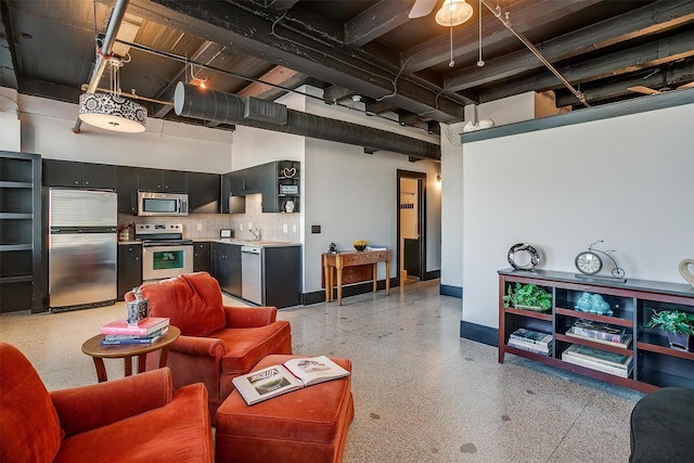 living room featuring sink and a towering ceiling