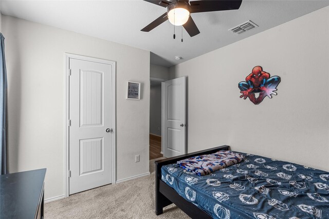 bedroom with light colored carpet