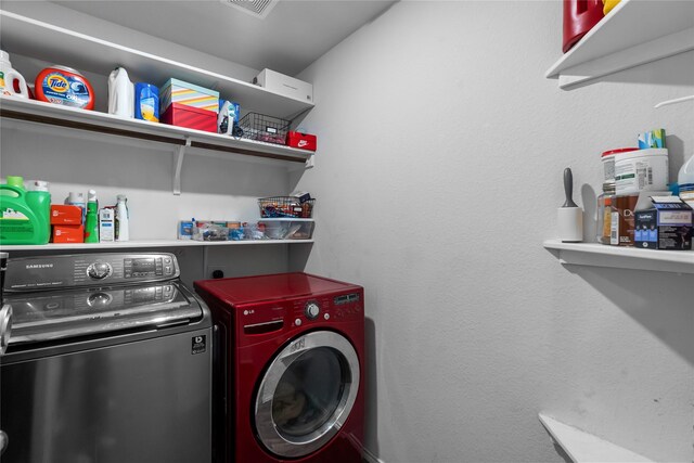 laundry room featuring separate washer and dryer