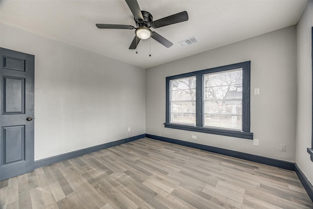 unfurnished room featuring light hardwood / wood-style flooring and ceiling fan