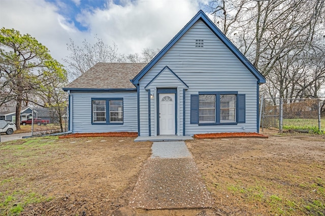 bungalow-style home featuring a front lawn